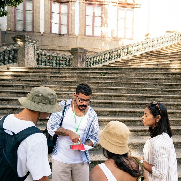 A guide explaining a landmark to travellers